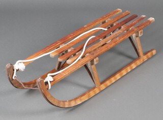 A Davos German toboggan 28cm h x 94cm l x 28cm w (signs of old but treated worm in places)