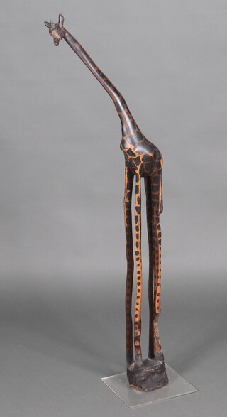 A carved African figure of a standing giraffe 108cm h 