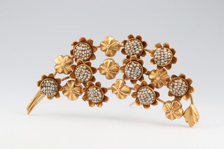 A yellow gold, testing as 18ct, leaf spray brooch set demi pearls, 13.7 grams gross 