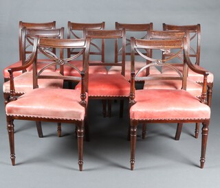 A set of 9 19th Century mahogany bar back dining chairs with X framed backs, leather overstuffed seats, raised on turned supports - 2 carvers, 7 standard 