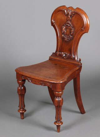 A 19th Century shaped mahogany hall chair with solid seat, raised on turned supports 88cm h x 46cm w x 38cm d 