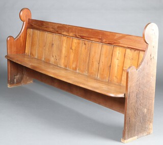 A Victorian pitch pine pew 102cm h x 200cm w x 47cm d 