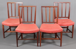 A set of 4 19th Century mahogany stick and rail back dining chairs with overstuffed seats, on square tapered supports with h framed stretchers 89cm h x 52cm w x 46cm d 