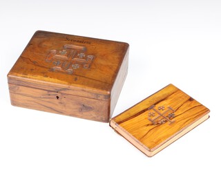An olive wood trinket box with hinged lid, the top carved a Jerusalem cross 8cm x 20cm x 17cm (split to top) together with a red letter New Testament with olive wood binding 