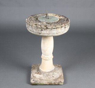 A metal sun dial, raised on a well weathered concrete column with square base 65cm x 34cm (in 2 sections) 