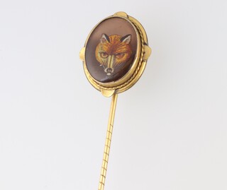 A gilt metal stick pin decorated a foxes mask 