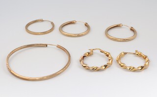 A pair of 9ct yellow gold twist hoop earrings, 1 other pair and 2 odd 9ct earrings 6.3 grams