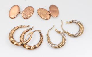 A pair of 9ct gold engraved oval cufflinks, 2.2 grams together with 2 pairs of 9ct gold hoop earrings 3.2 grams  