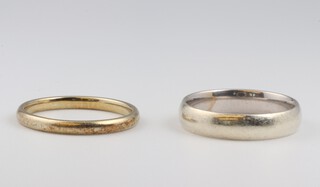 A 9ct white gold wedding band, size N, 3.2 grams together with a 9ct yellow gold wedding band, size N, 1.8 grams