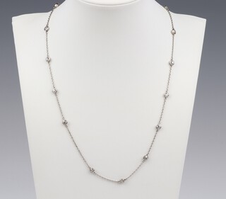 An Edwardian, possibly platinum, interspersed with 16 diamonds necklace, each diamond approx. 0.10ct, 1.6ct in total  