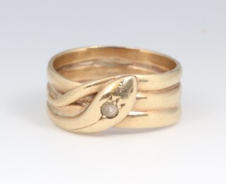 A 9ct yellow gold snake ring, set a paste stone to the head, size V, 7.6 grams 