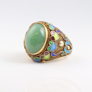 A 1930's Chinese jade and enamelled ring, testing as 22ct, size G
