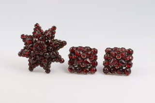 A Victorian gilt metal and garnet set brooch (1 stone missing) together with a pair of matching studs 