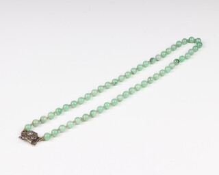A Chinese 1920's/1930's jade necklace with silver clasp 