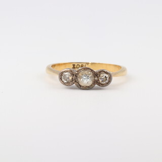 A yellow gold testing as 18ct 3 stone diamond ring, diamonds approx 0.3ct size L, 2.6 grams
