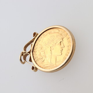 A 1911 French gold franc, set in a yellow gold testing as 9ct pendant mount 