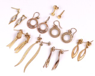 Eight pairs of 9ct yellow gold earrings (3 without butterflies) 7.3 grams