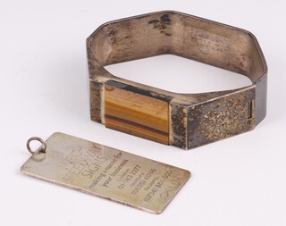 A Finish silver bracelet set a rectangular carved hardstone together with a silver promotional pendant 66.2 grams gross