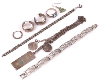 A silver ingot pendant on a silver chain, a silver St Christopher ditto, a silver dress ring size Q, 2 silver bracelets and 2 silver earrings 67.2 grams 
