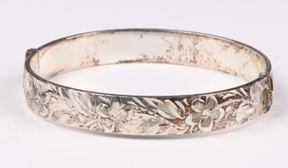 An engraved silver bangle 17.6 grams 