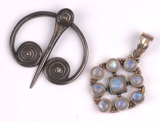 A Scottish penannular silver "shawl" brooch pin Birmingham 1938, the reverse marked Iona ICA together with a silver pendant set cabochon cut moonstones 
