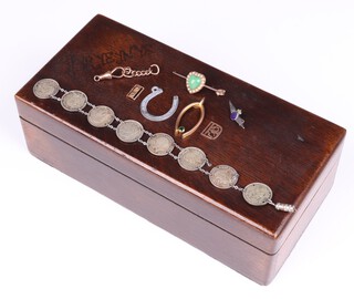 A yellow gold testing as 14ct bar brooch, set a green cabochon heart shaped stone surrounded by diamonds (pin a/f) 3.2g, a 9ct hollow gold wishbone brooch (pin a/f), a 9ct gold Albert dog clip, a 9ct yellow gold clip, weighable items 4 g gross, together with a bracelet formed of sixpences (a/f)