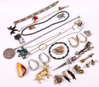 A  gilt metal brooch in the form of a dog and a quantity of costume jewellery 