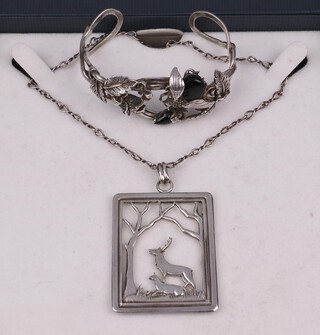 A 925 silver bracelet decorated an insect together with a Carl Hansen pierced 830 pendant in the form of stags marked CBH, 46.9 grams gross  