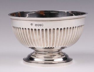 A Victorian circular silver sugar bowl with demi-reeded decoration, London 1884 by Charles Stuart Harris, 191 grams 