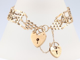 A 9ct yellow gold gate bracelet with 2 padlock clasps, 7.4 grams 