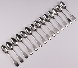 Thirteen Georgian silver fiddle pattern teaspoons London 1781 by Walter Brind with armorial decoration and a Victorian ditto London 1852, 322 grams  