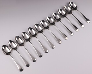 Twelve matched silver Old English pattern table spoons - 4 Sheffield 1913, 2 x 1914, 6 x 1915, by Walker & Hall, all monogrammed, 926 grams 