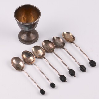 A silver egg cup Birmingham 1966, 6 silver bean end coffee spoons Birmingham 1924