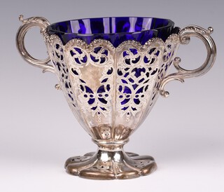 A Victorian pierced silver twin handled bowl with blue glass liner, Sheffield 1850 by Henry Wilkinson & Co. 209 grams 