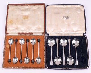 A set of 6 silver bean end coffee spoons Sheffield 1914 and 5 silver Old English pattern tea spoons London 1938, both cased, 101 grams gross 