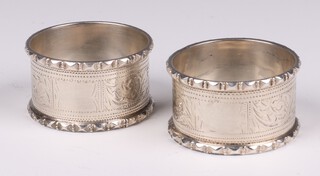 A pair of engraved silver napkin rings Birmingham 1901, marks rubbed, 52 grams 