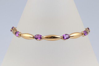 A 14ct yellow gold bracelet set 8 oval cut amethysts, 18cm  4.7 grams 