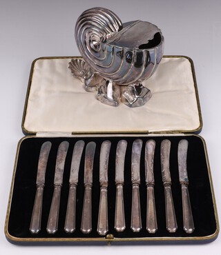 A Britannia metal shell shaped spoon warmer 13cm and a set of 10 silver handled tea knives, cased 