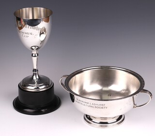 A silver plated goblet shaped trophy cup and a Gothic style silver plated twin handled trophy cup by the Northern Goldsmiths Co. (both with inscriptions) 