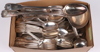An 85 piece canteen of silver plated fiddle, thread and shell pattern flatware with armorial decoration comprising 21 table spoons, 18 dinner forks, 18 pudding spoons, 18 pudding forks, 4 sauce ladles, 5 mustard spoons, basting spoon and ladle 