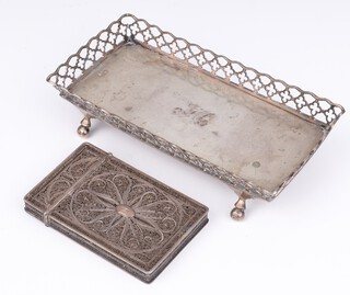 A rectangular Eastern silver pen tray with pierced gallery raised on ball supports 16.5cm, monogrammed, together with a filigree card case 9cm, 182 grams