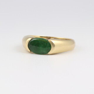 A 14ct gold dress ring, set a rectangular green hardstone, size R 1/2, 4.3 grams 