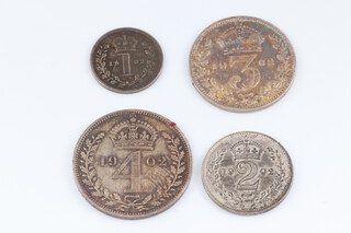 An Edwardian set of Maundy coins dated 1902 in a later fitted red case 