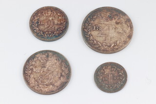 A selection of Victorian Maundy coins dated 1882 in a later fitted Maundy Money case 