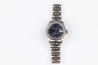 A lady's Rolex Oyster perpetual date wristwatch with blue dial, contained in a stainless steel case on an integral stainless steel bracelet, the case numbered 568B, compete with original box and certificate numbered 160, the watch was purchased on the 24th December 2002
