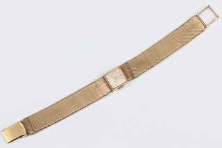 A lady's Longines wristwatch contained in a 9ct yellow gold case with integral gold bracelet, 35 grams gross 