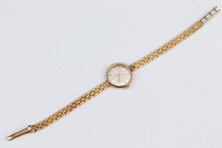 A lady's Rotary wristwatch contained in a 9ct yellow gold case with integral gold bracelet, 15.77 grams 