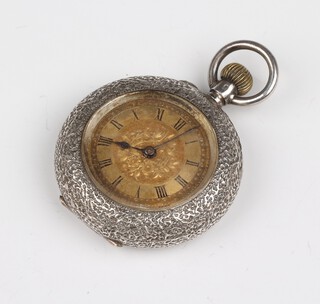 A lady's keyless, open faced fob watch with gilt dial and Roman numerals, the back marked DF&C, contained in a silver case 