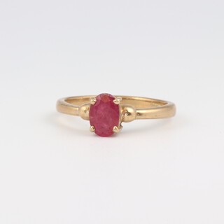 A 9ct yellow gold ring set a pink stone, size N, 2.2 grams 