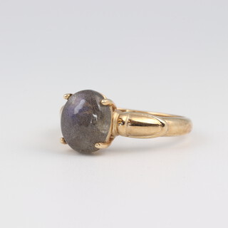 A 9ct yellow gold ring set a cabochon cut moonstone (chip to stone), size N, 3.2 grams